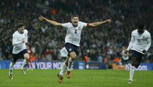 Steven Gerrard celebrates scoring England's second goal against Poland and sending the Three Lions to the World Cup.
