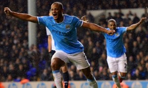 Vincent Kompany celebrates scoring City's fifth in a 5-1 victory at White Hart Lane