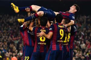 Lionel Messi of FC Barcelona celebrates with his teammates after setting Spanish goal scoring record.